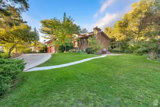 View of driveway and newly laid path to entry of basement apartment.