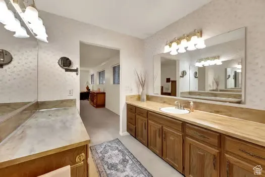 Generous Master Bathroom with two extra large counters & mirrors, & more privacy with separate tub and toilet room.