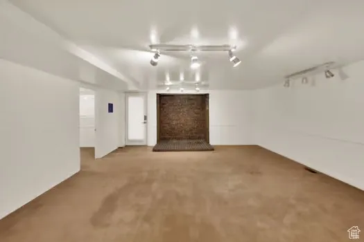 Bsmt Apartment Family Room and Dining Rm (Nice and Open) featuring adjustable rail lighting