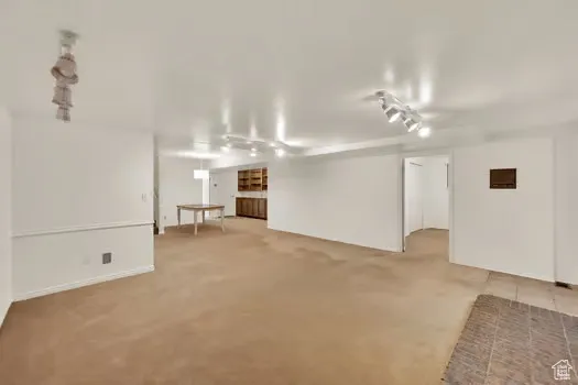Open Bsmt Family Room and Dining with built-in shelving and lot of extra storage!