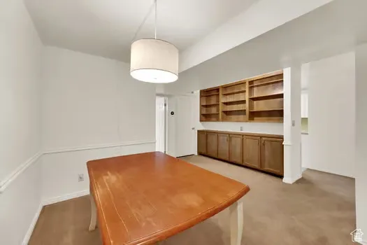 Dining Rm with lots of built-in shelves/cabinets and extra storage space
