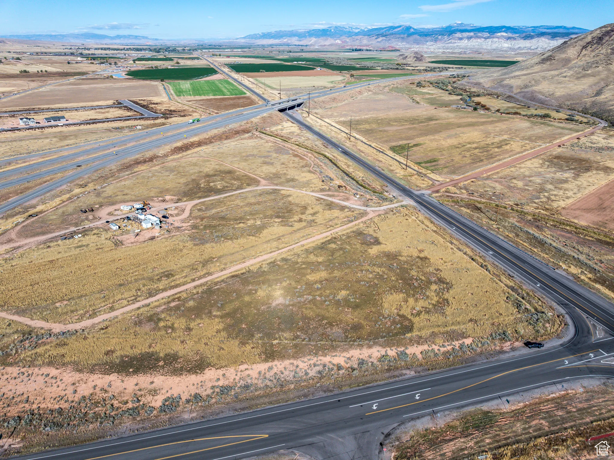 Aerial overview of property's location with mountains and rural landscape
