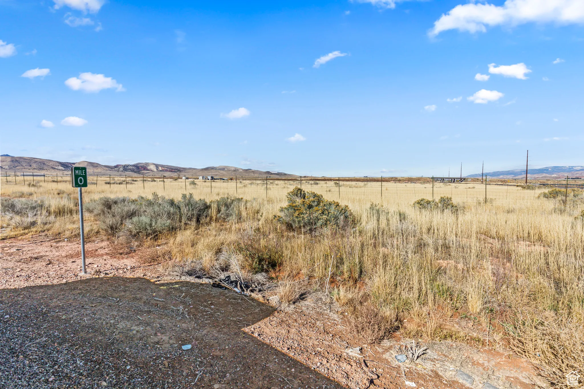 View of yard featuring a view of rural / pastoral area and a mountain view