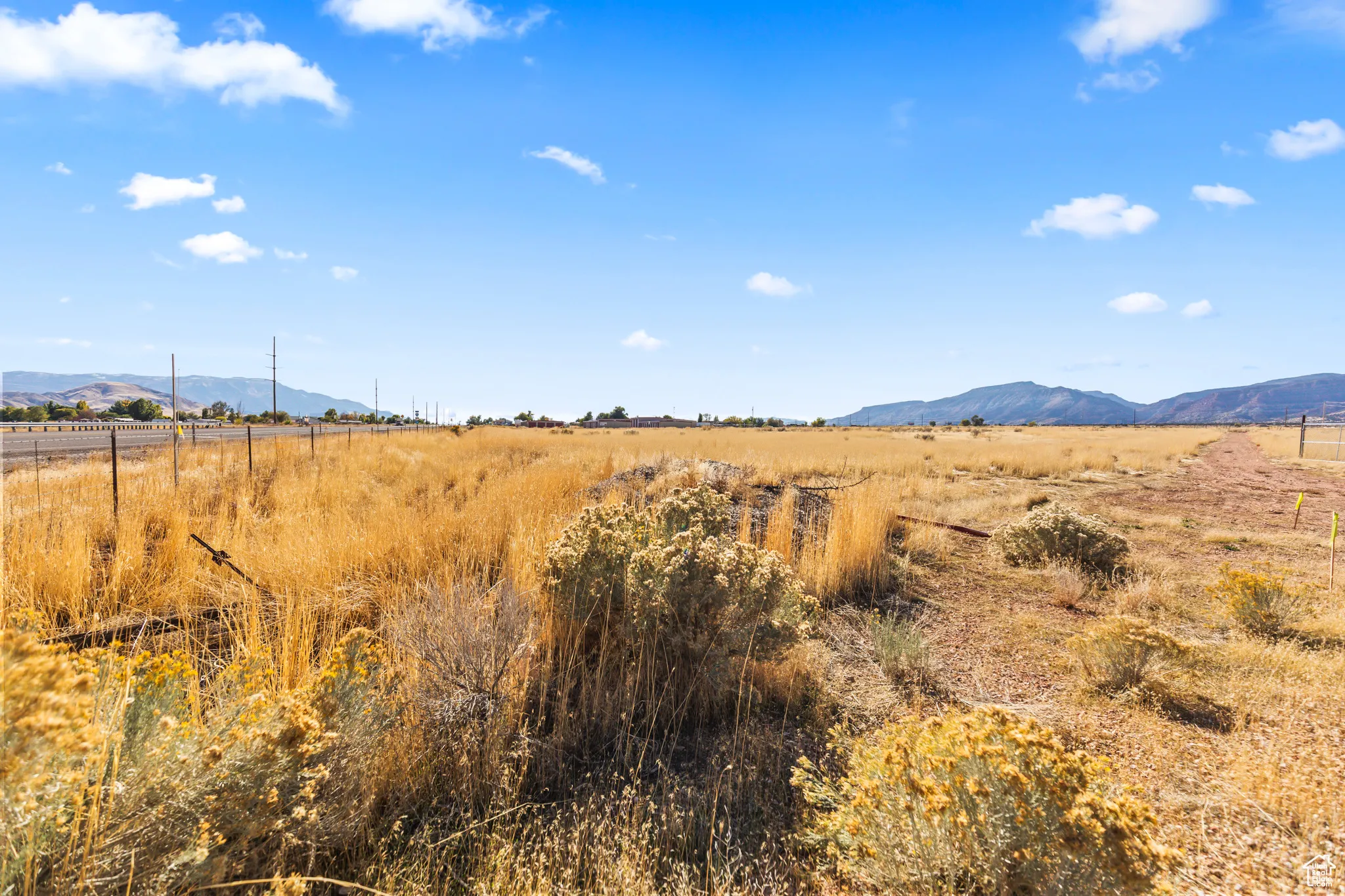 View of mountain backdrop featuring rural landscape
