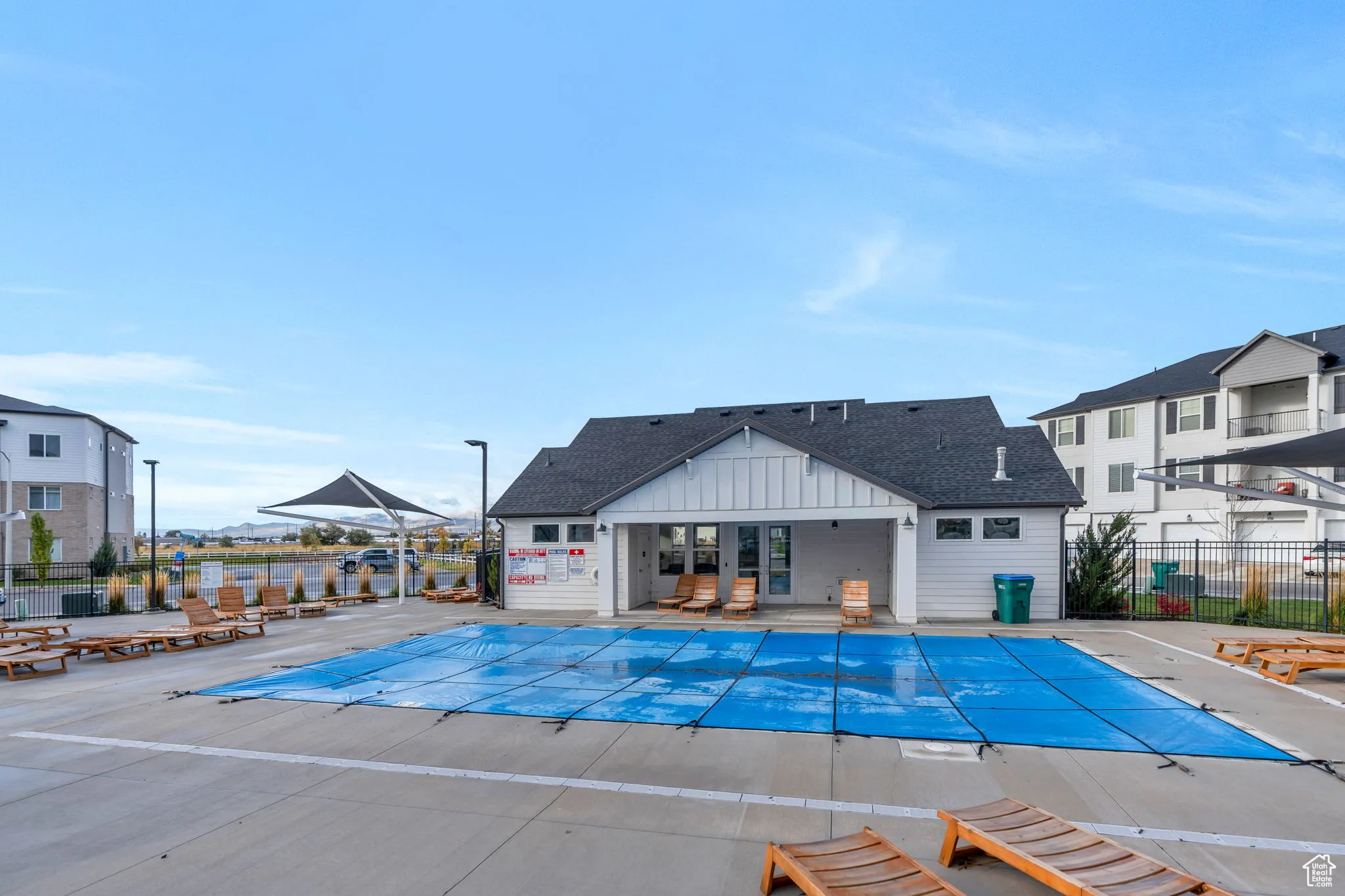 Community pool with a patio
