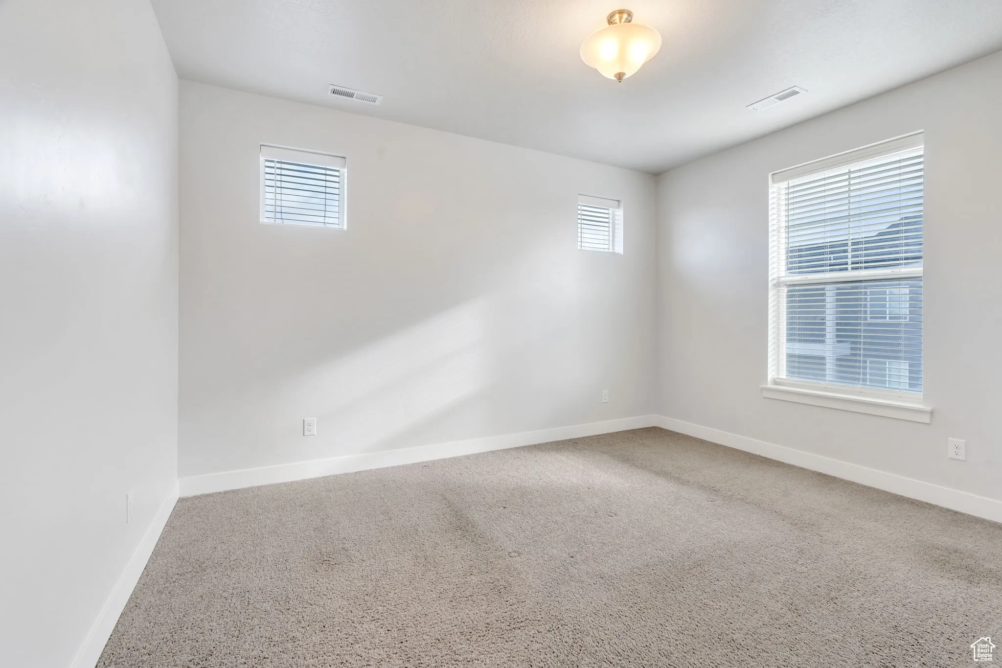 Spacious primary bedroom. Seller will replace the carpet.