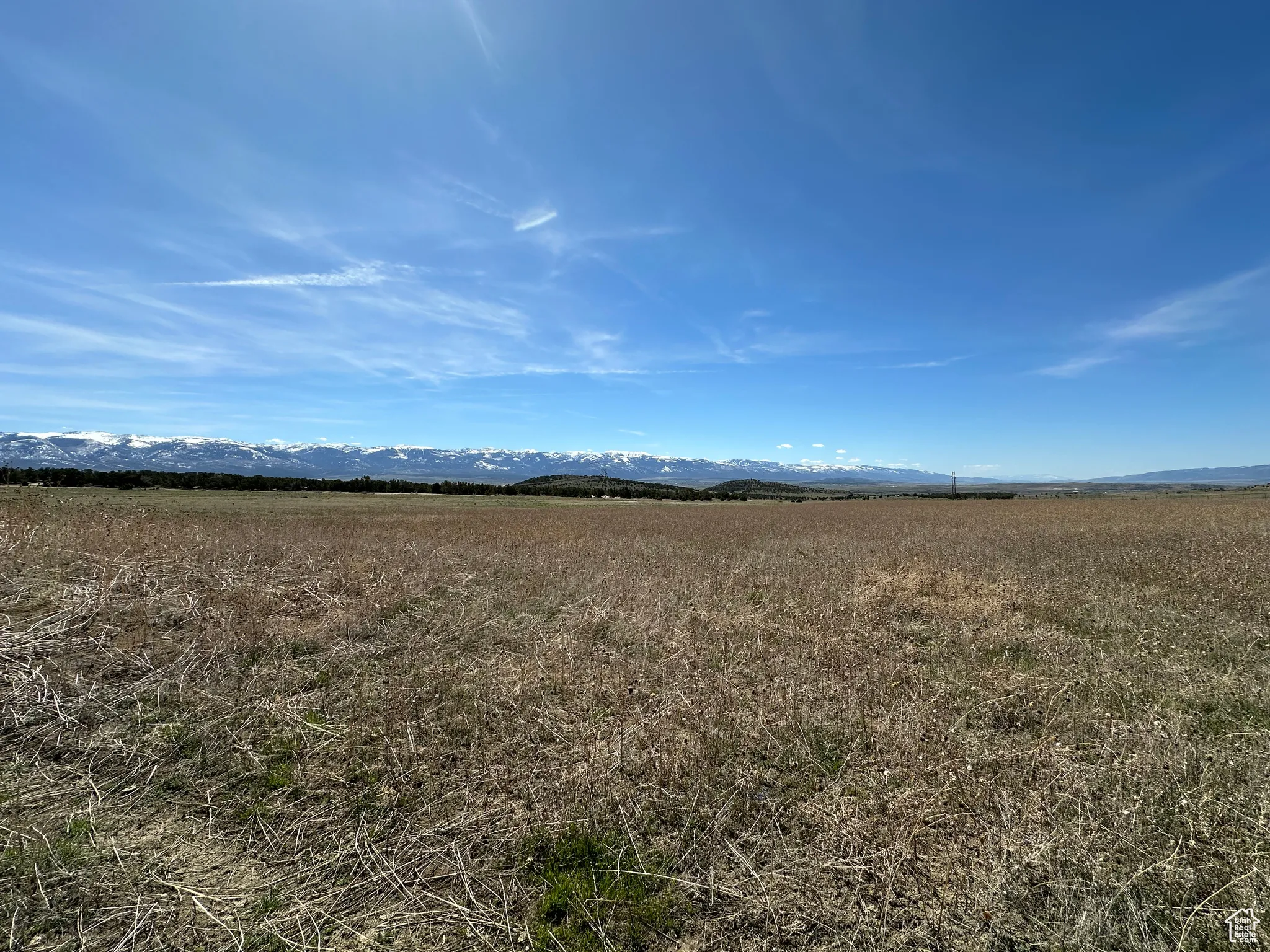 View of undeveloped land featuring rural landscape and mountains