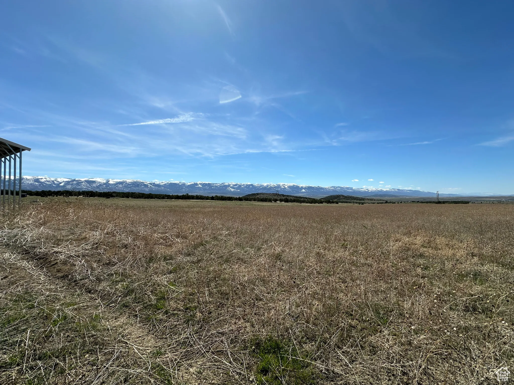 View of yard with a rural view and a mountain view