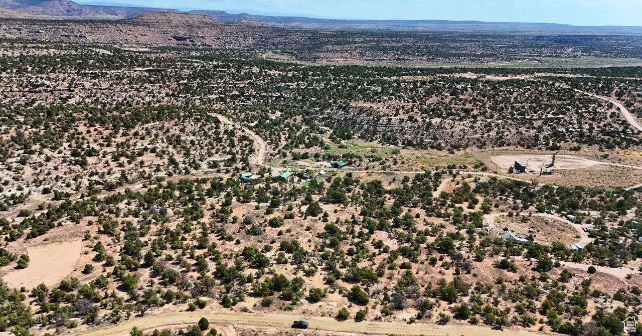 Overview of rural landscape featuring a mountainous background and a desert landscape