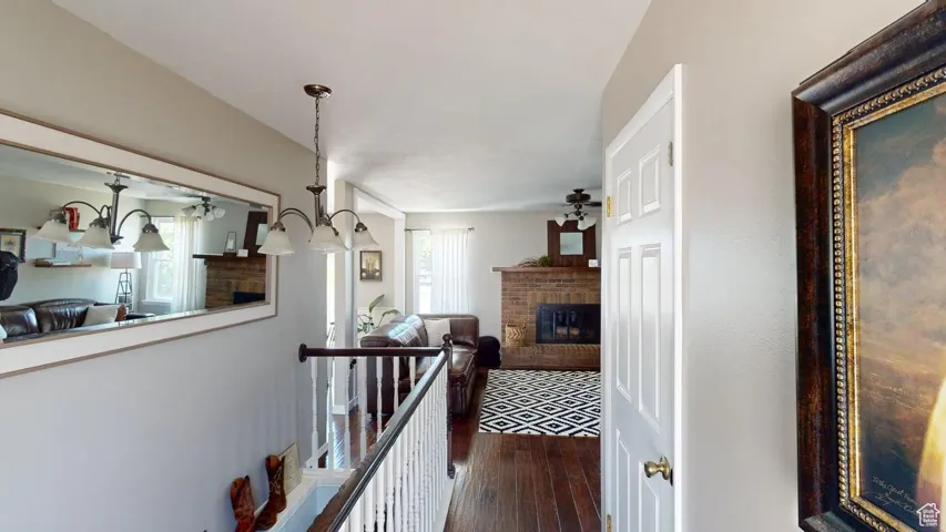 Hallway featuring dark wood finished floors and plenty of natural light