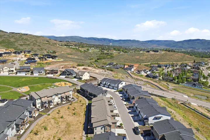 Expansive aerial perspective showcasing a residential community with varied architectural styles