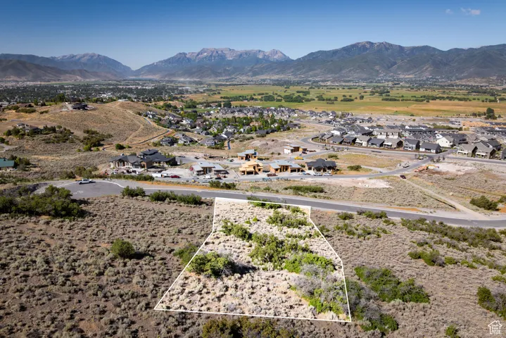View of mountain backdrop featuring nearby suburban area