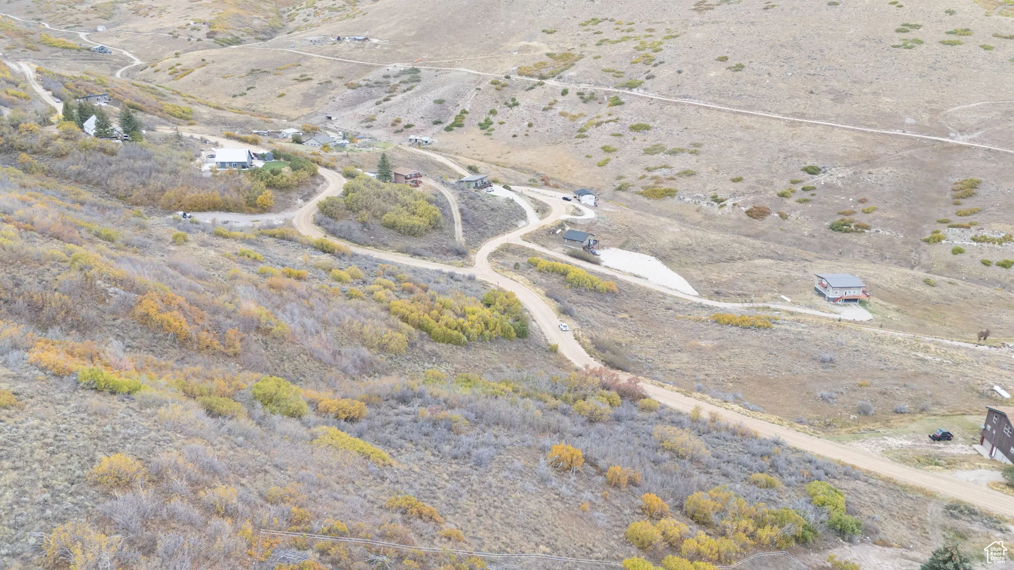 Aerial view of property and surrounding area featuring rural landscape and a desert landscape