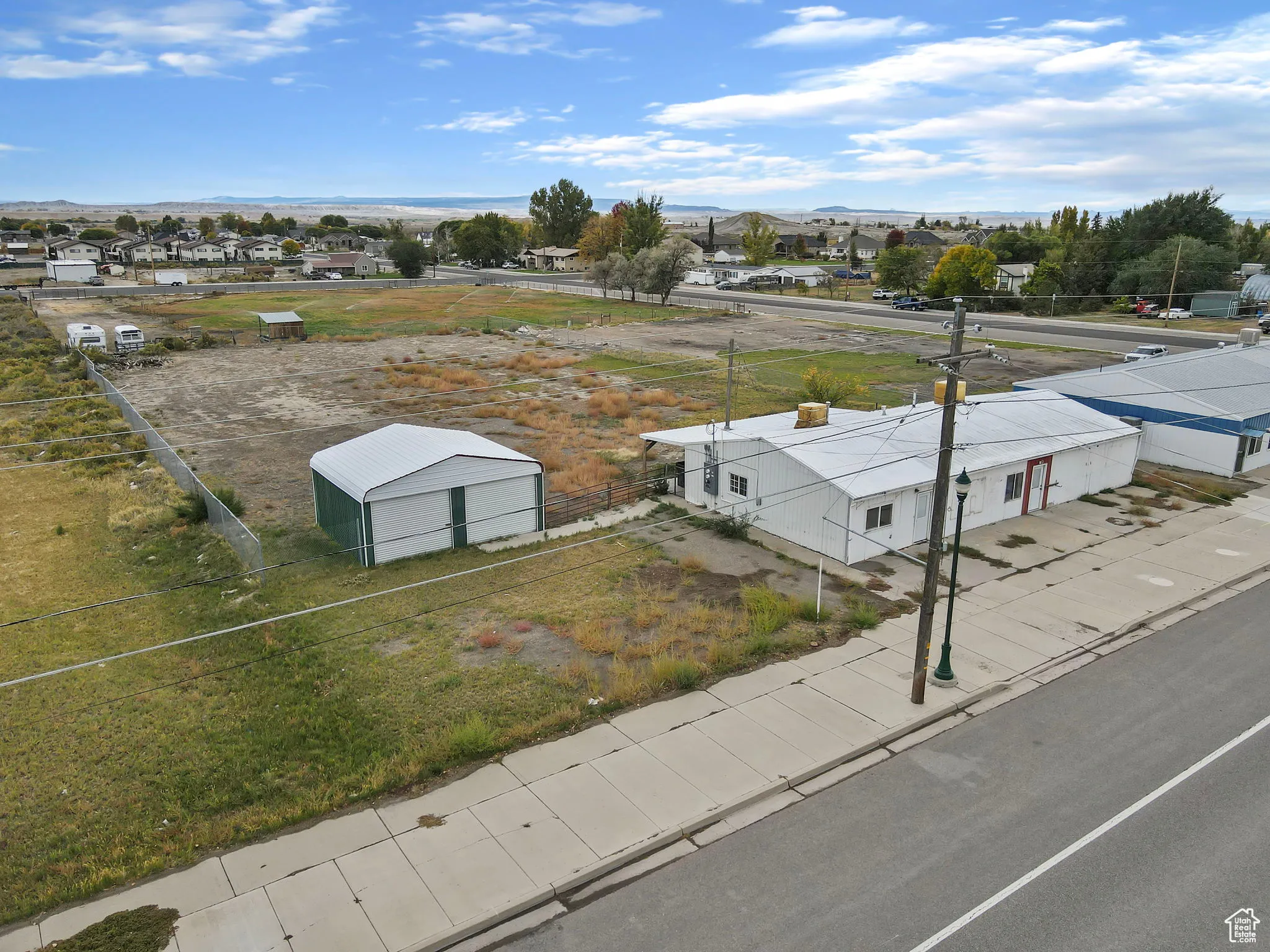 Aerial perspective of suburban area with a mountainous background