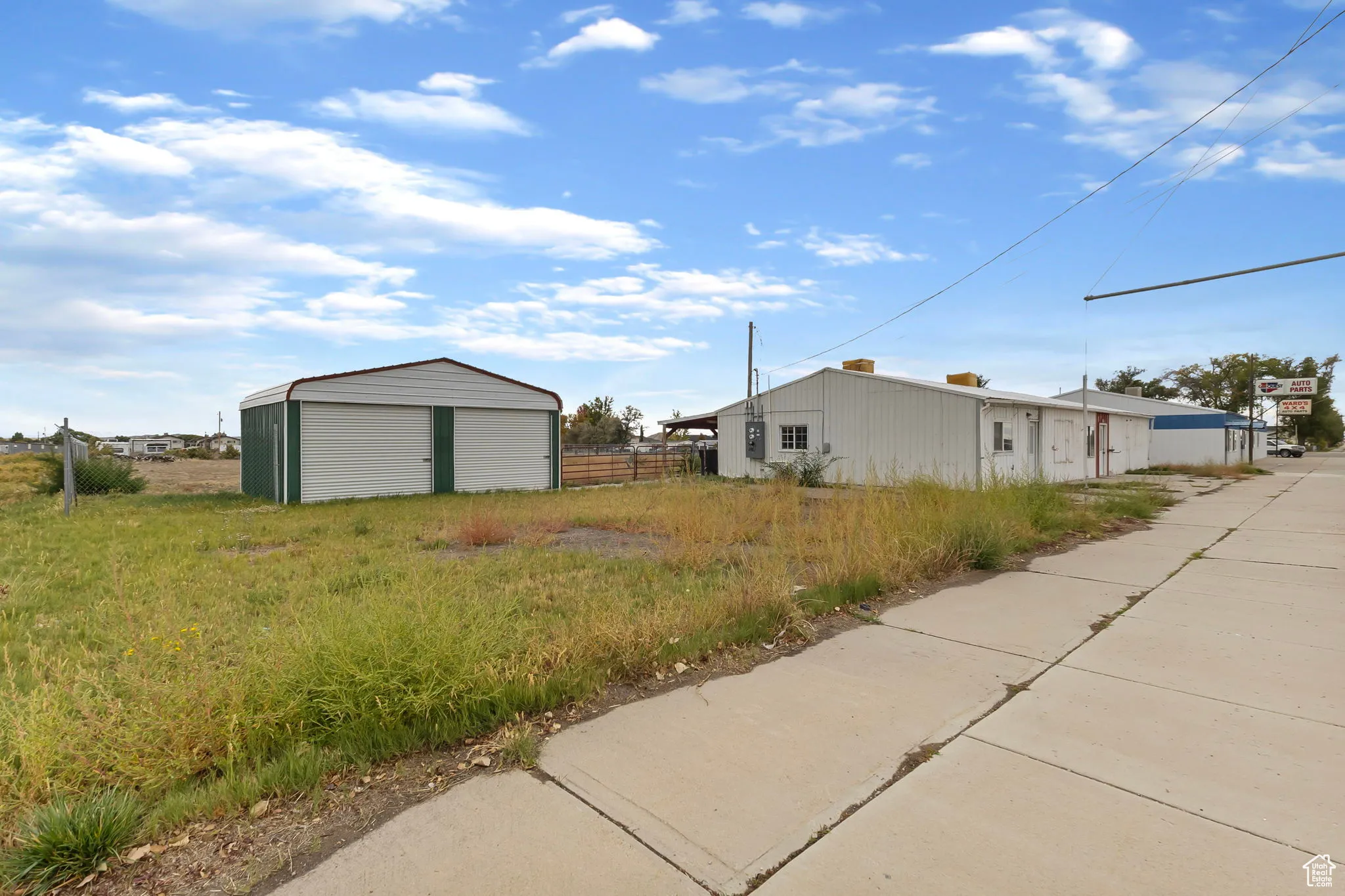 View of yard with an outdoor structure and an outbuilding