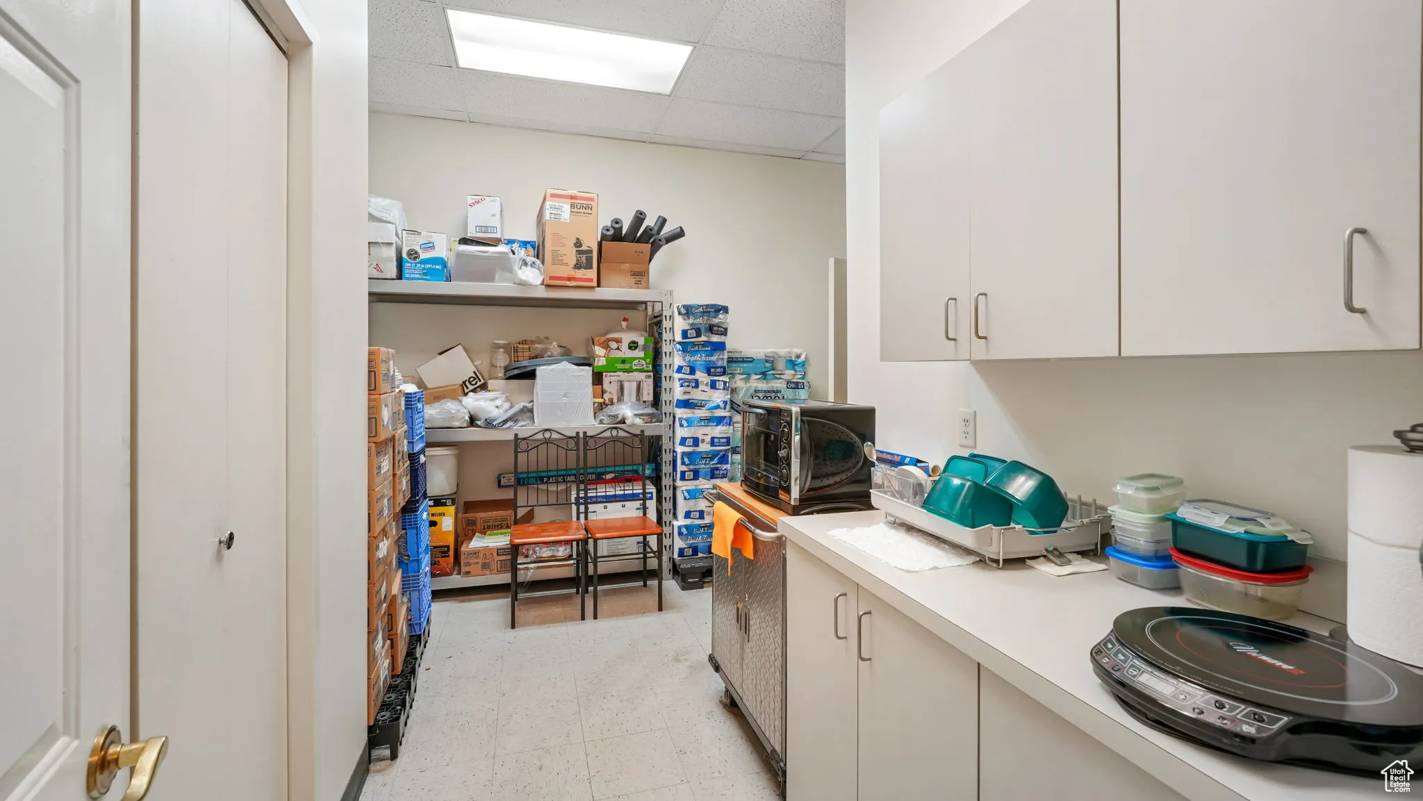 Laundry area with a paneled ceiling