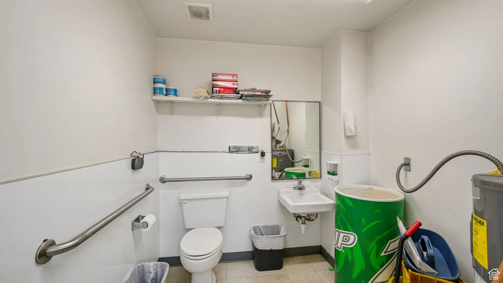 Bathroom featuring toilet and water heater