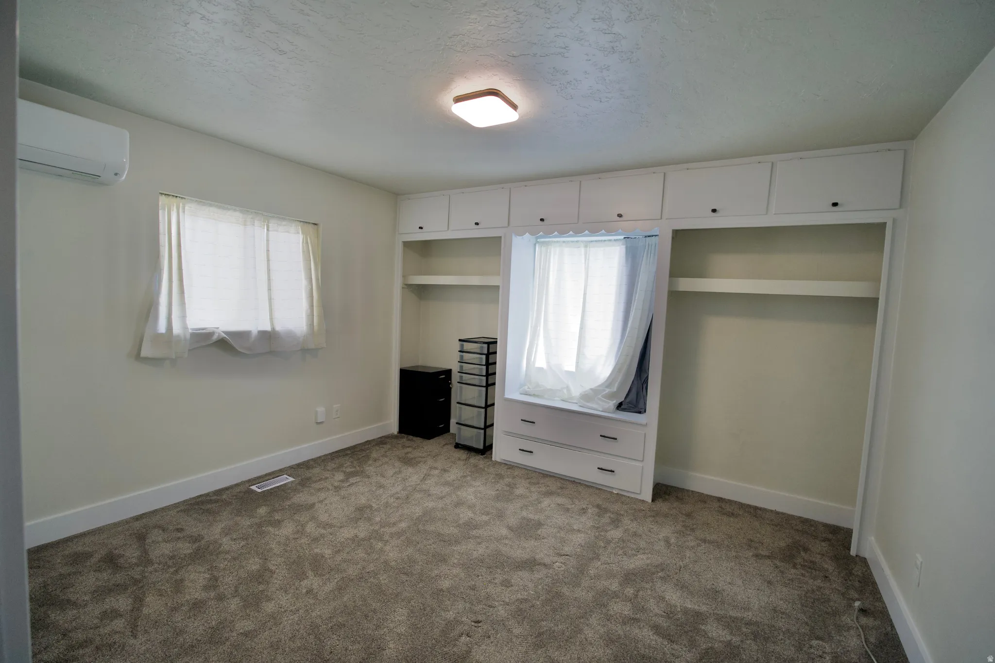 Built-in cabinetry with drawers and shelving