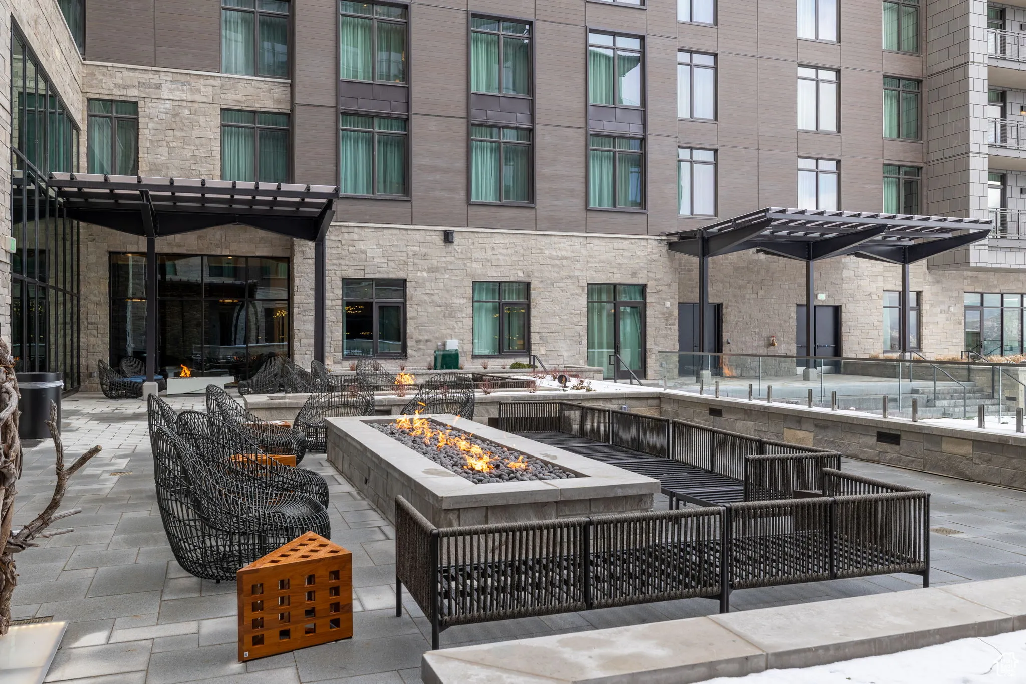 View of patio / terrace with a pergola and an outdoor living space with a fire pit