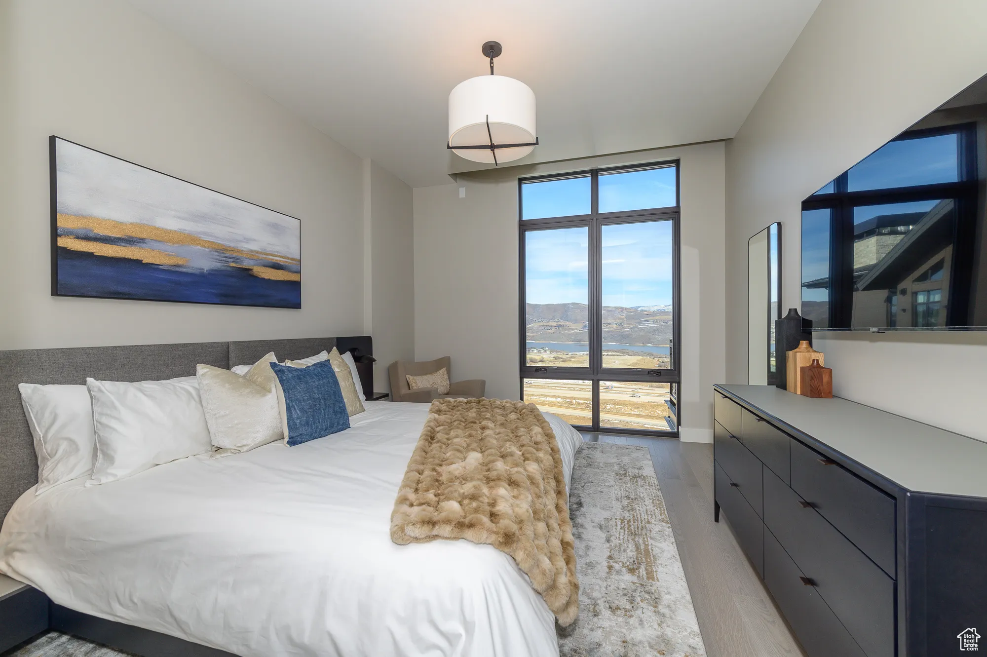 Bedroom with light wood-style floors