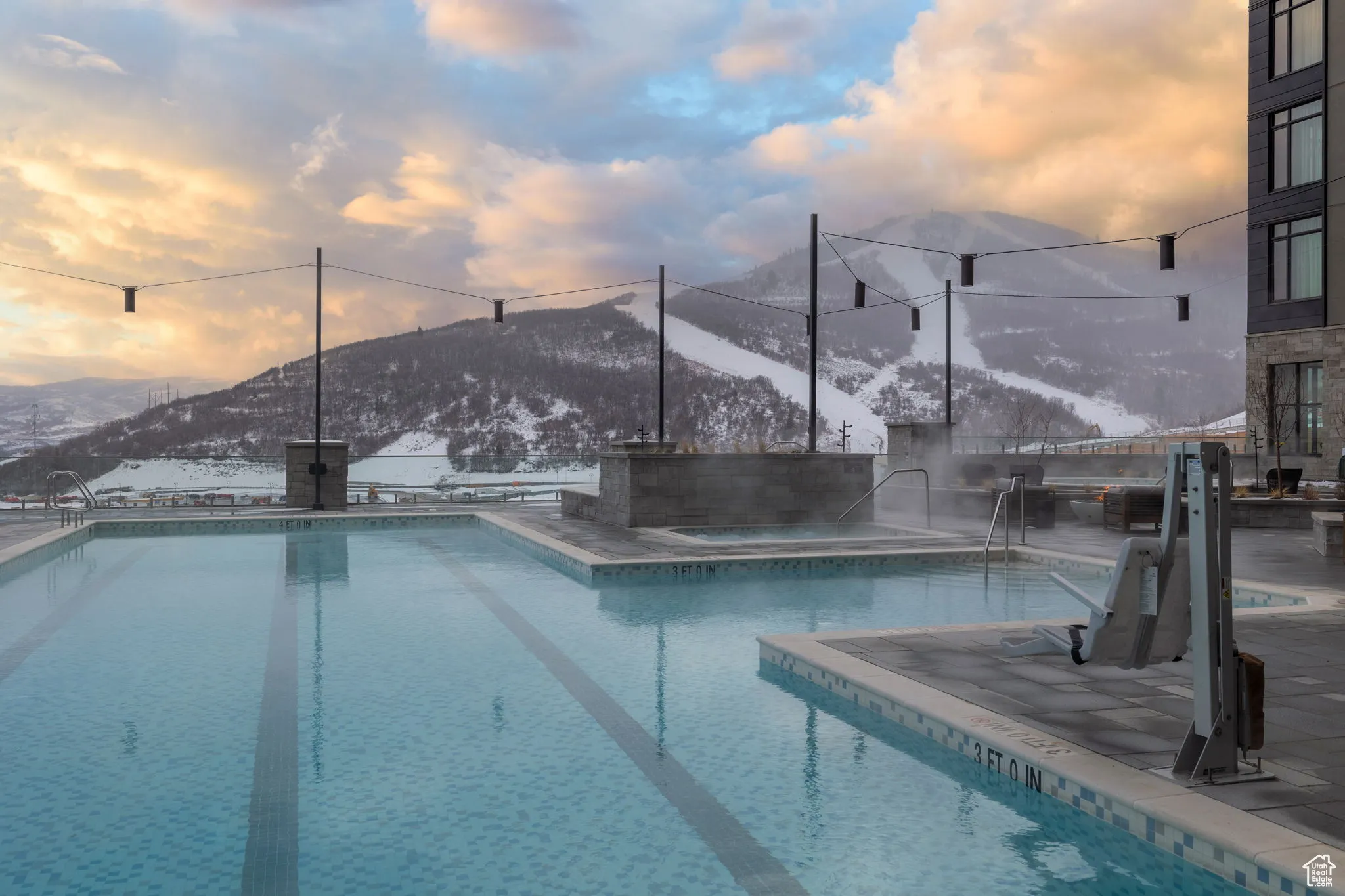 Community pool with a mountain view