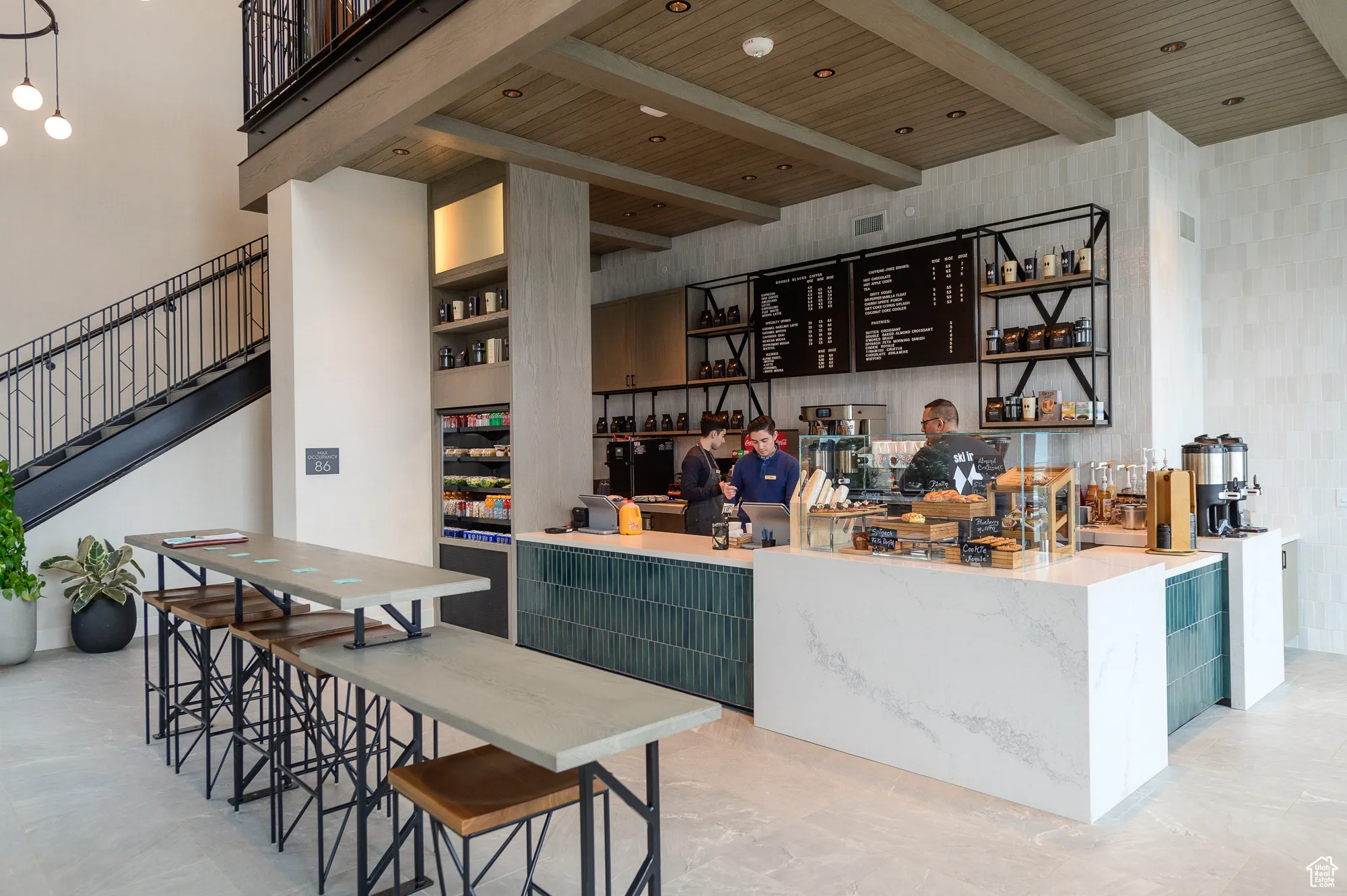 Bar featuring open shelves, a wood ceiling with exposed beams, a towering ceiling, stairway, and green cabinetry