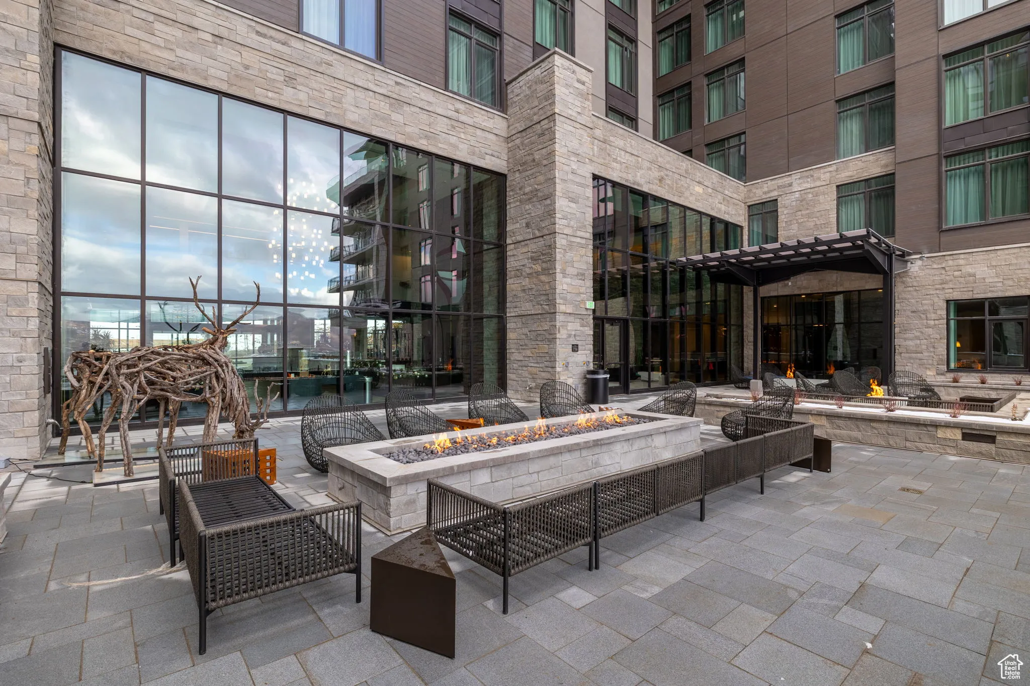 View of patio featuring a fire pit