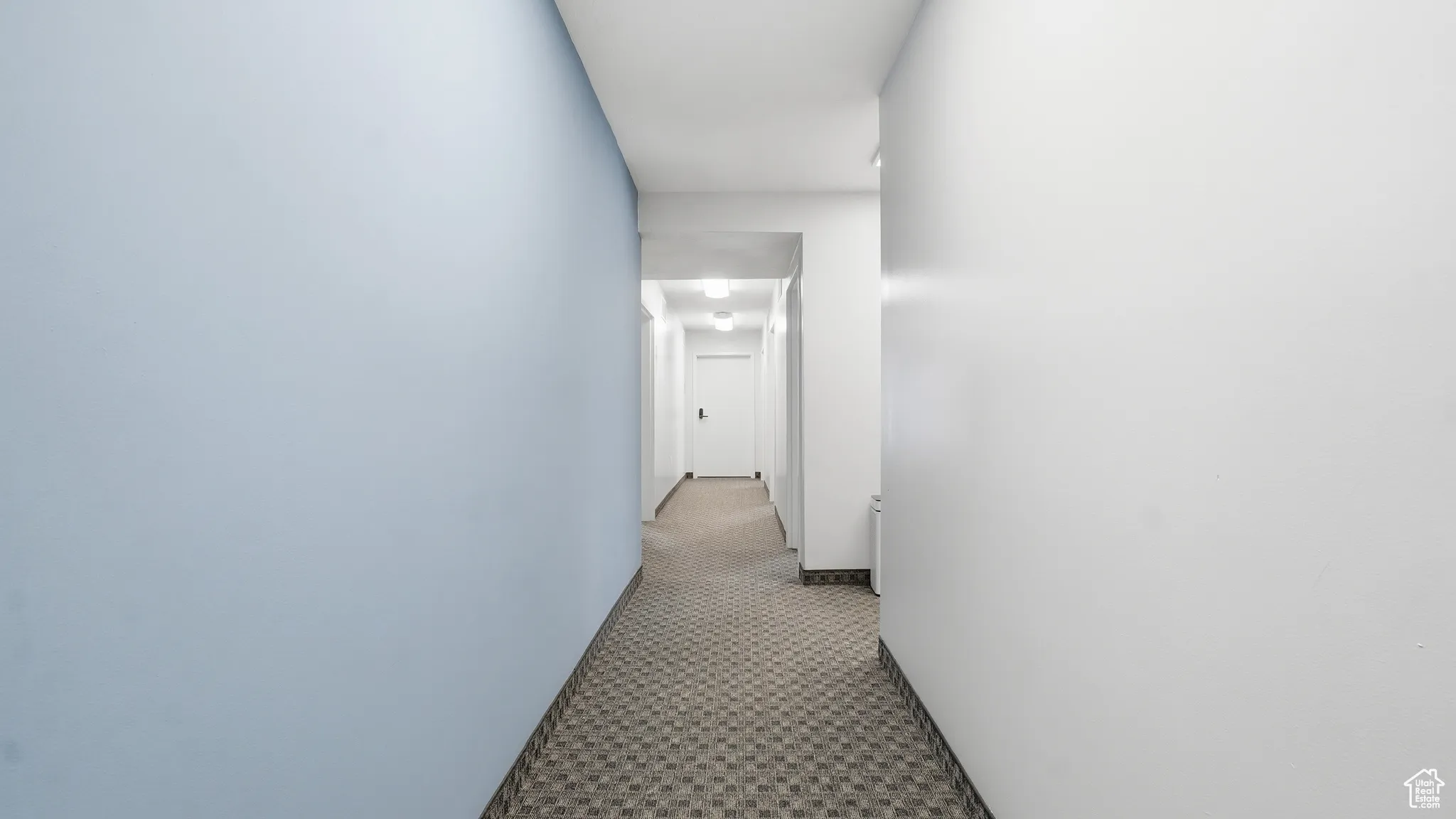 Hall featuring baseboards