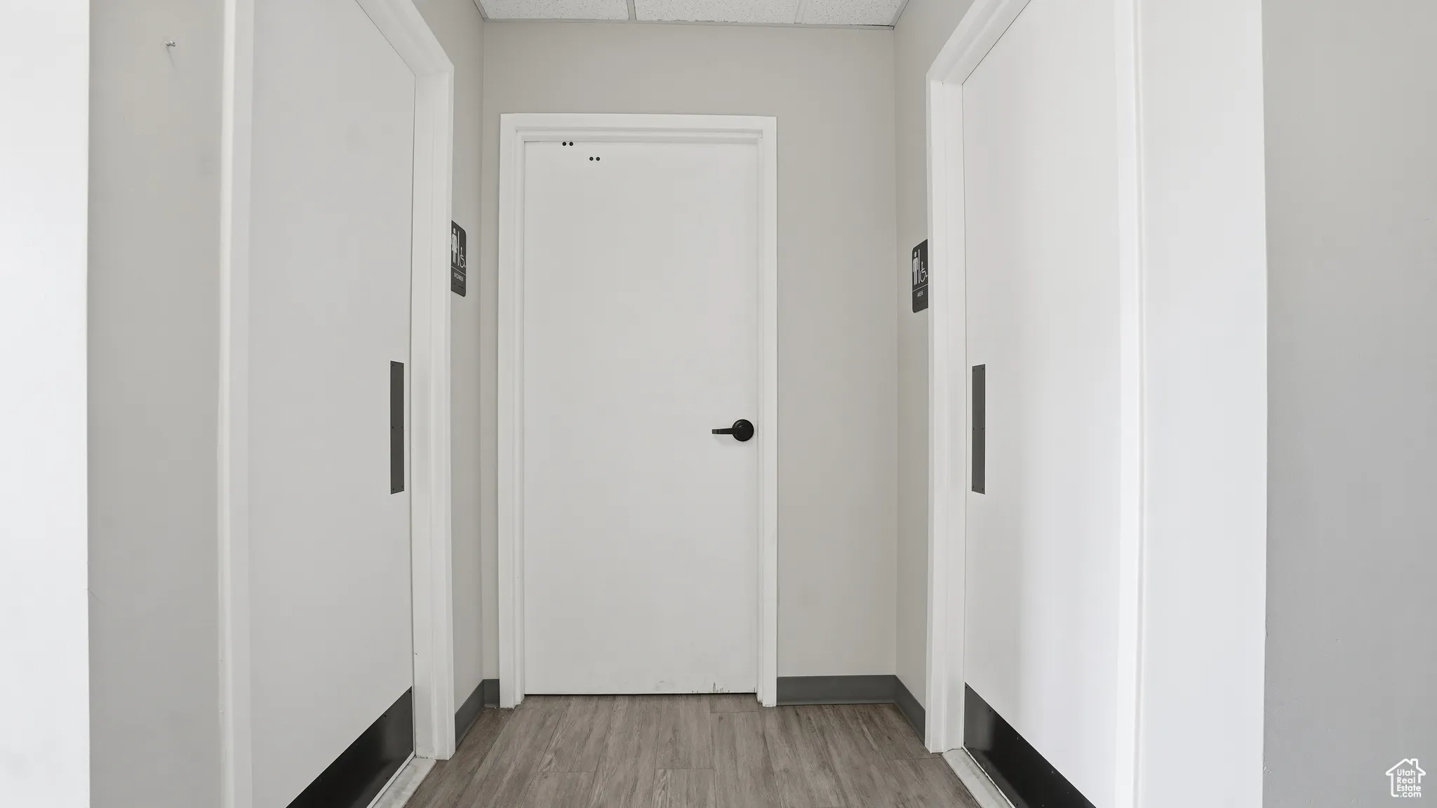 Hall featuring wood finished floors