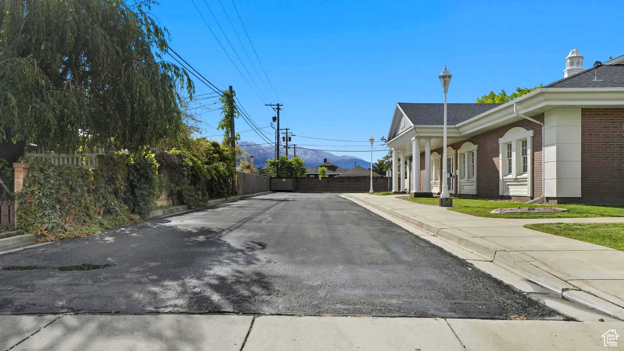 View of street featuring sidewalks, curbs, and a mountain view