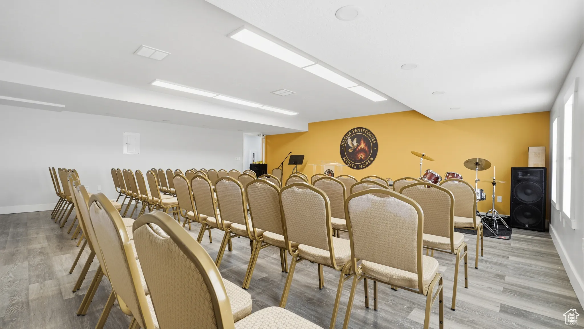 Dining space with light wood-style flooring and baseboards