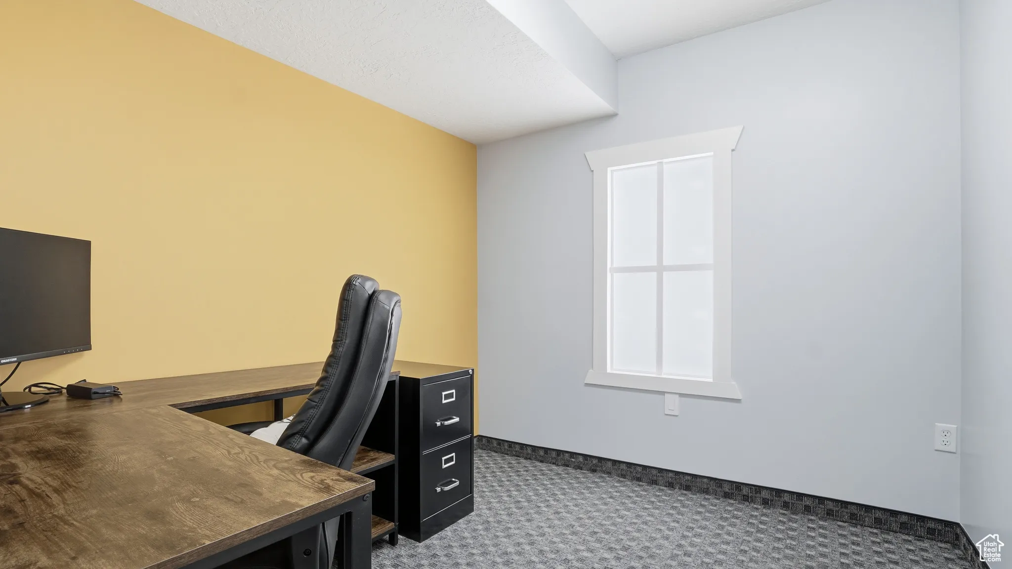 Office space with carpet floors and baseboards