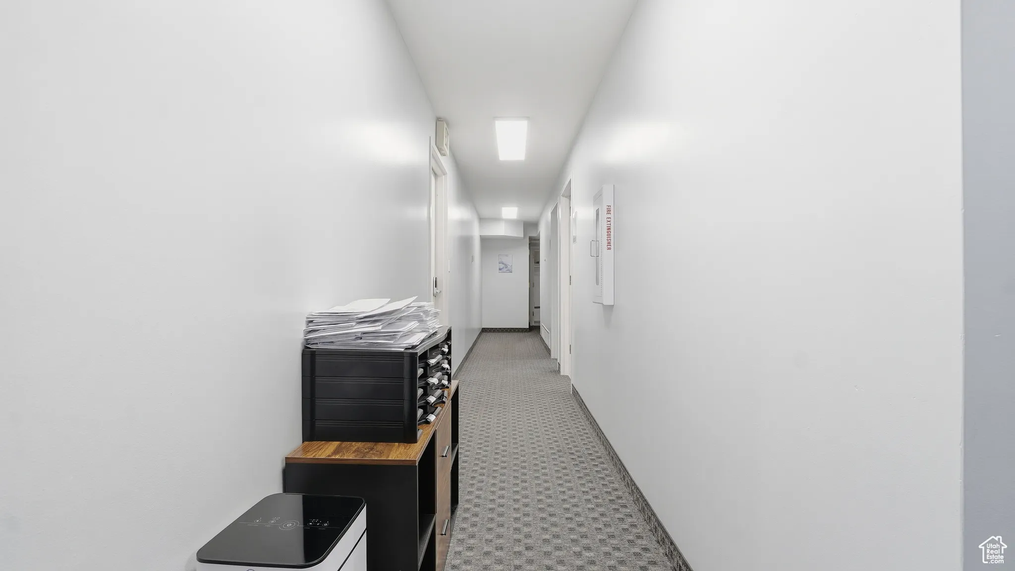 Corridor featuring baseboards
