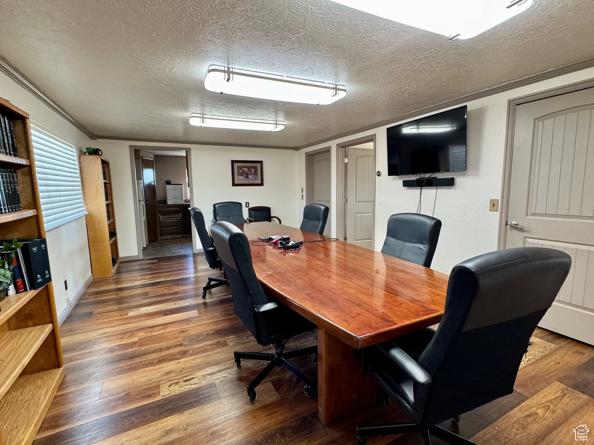 Office featuring a textured ceiling and wood finished floors