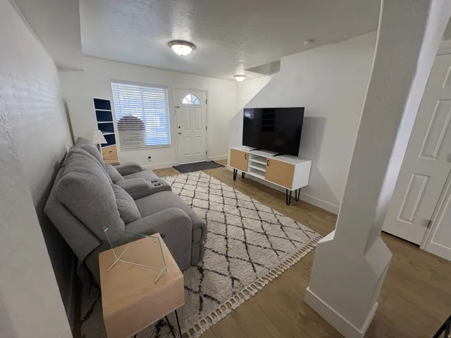 Bright and open living space featuring new wood-finish LVP flooring
