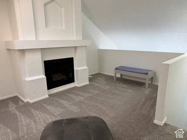 Loft space with fireplace. Could be used as an office, sitting room, a library, or a third bedroom.