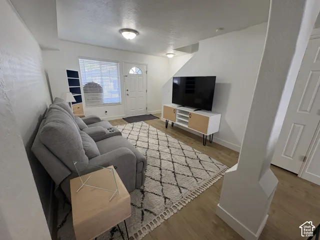 Bright and open living space featuring new wood-finish LVP flooring