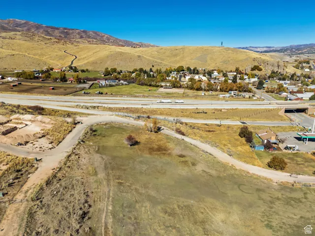 Aerial view of property's location with a mountainous background