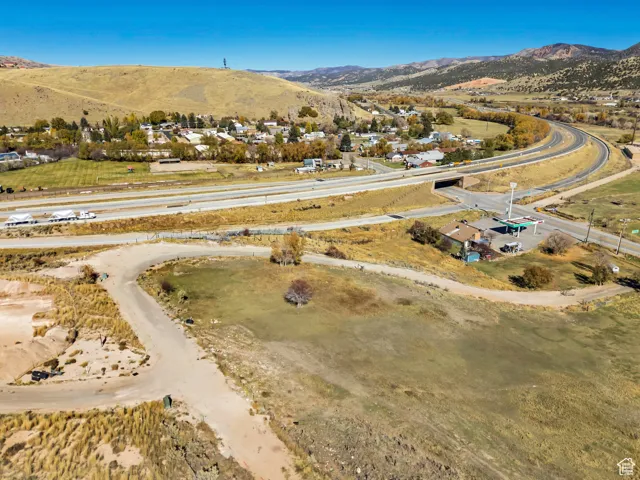Aerial overview of property's location featuring a mountainous background