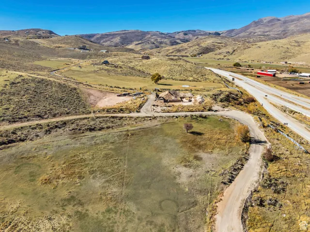 View of property location with a mountain backdrop and rural landscape