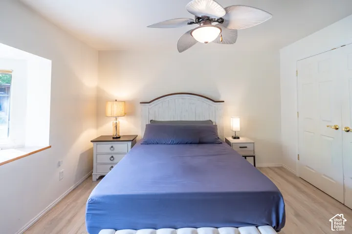 Bedroom featuring light wood-style flooring and a ceiling fan