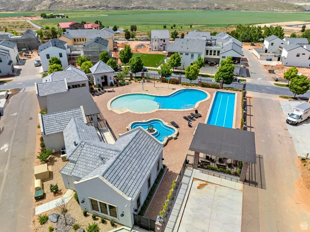 View of pool featuring a patio area and a residential view
