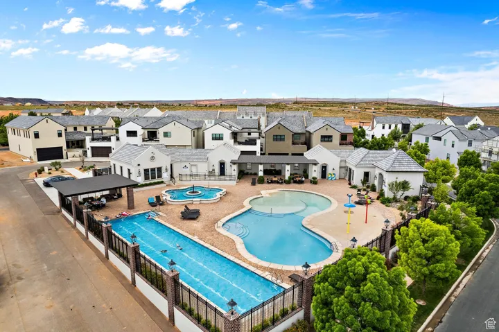 Aerial view of residential area featuring a pool