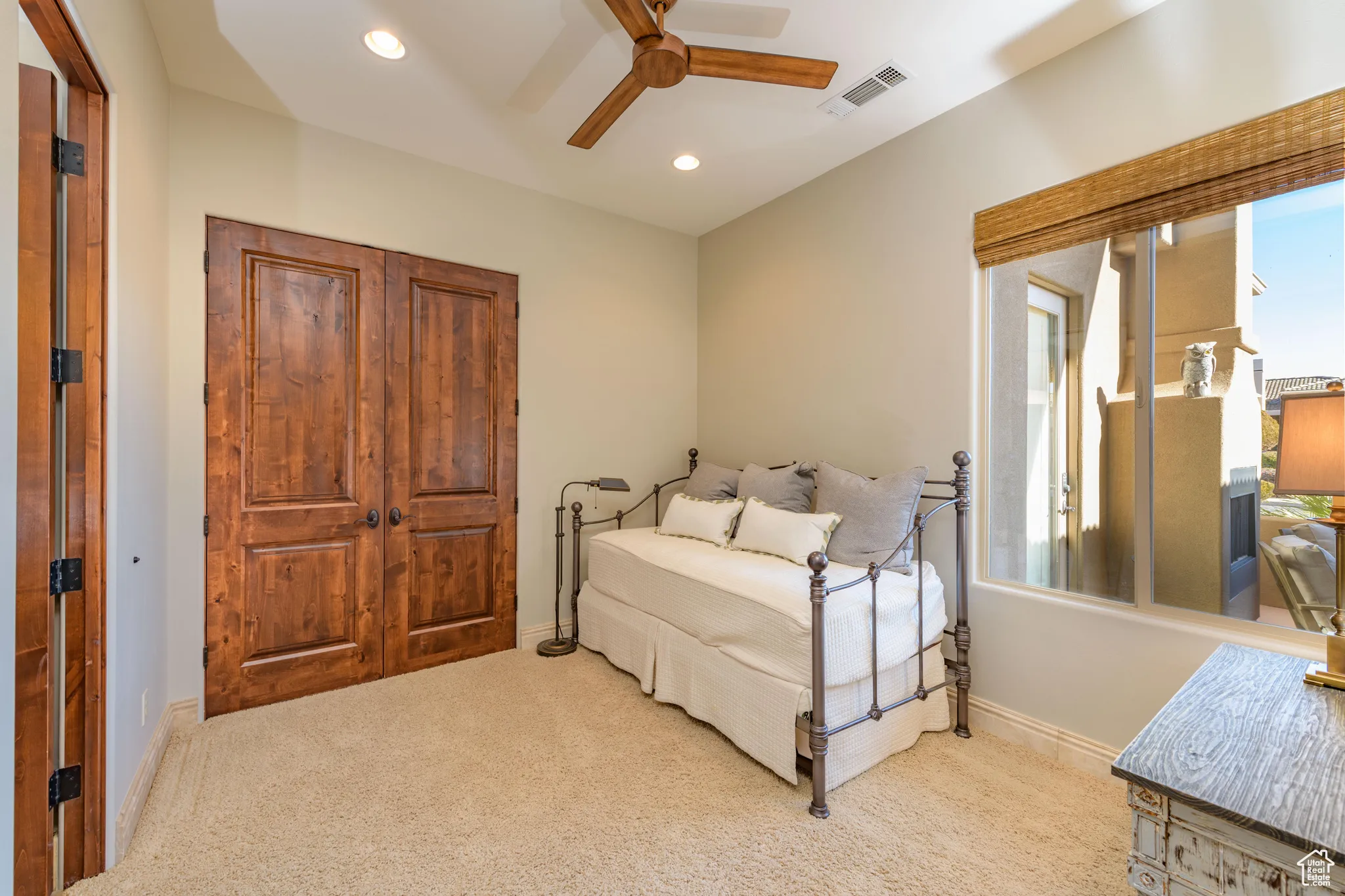 Bedroom featuring carpet flooring, ceiling fan, and recessed lighting