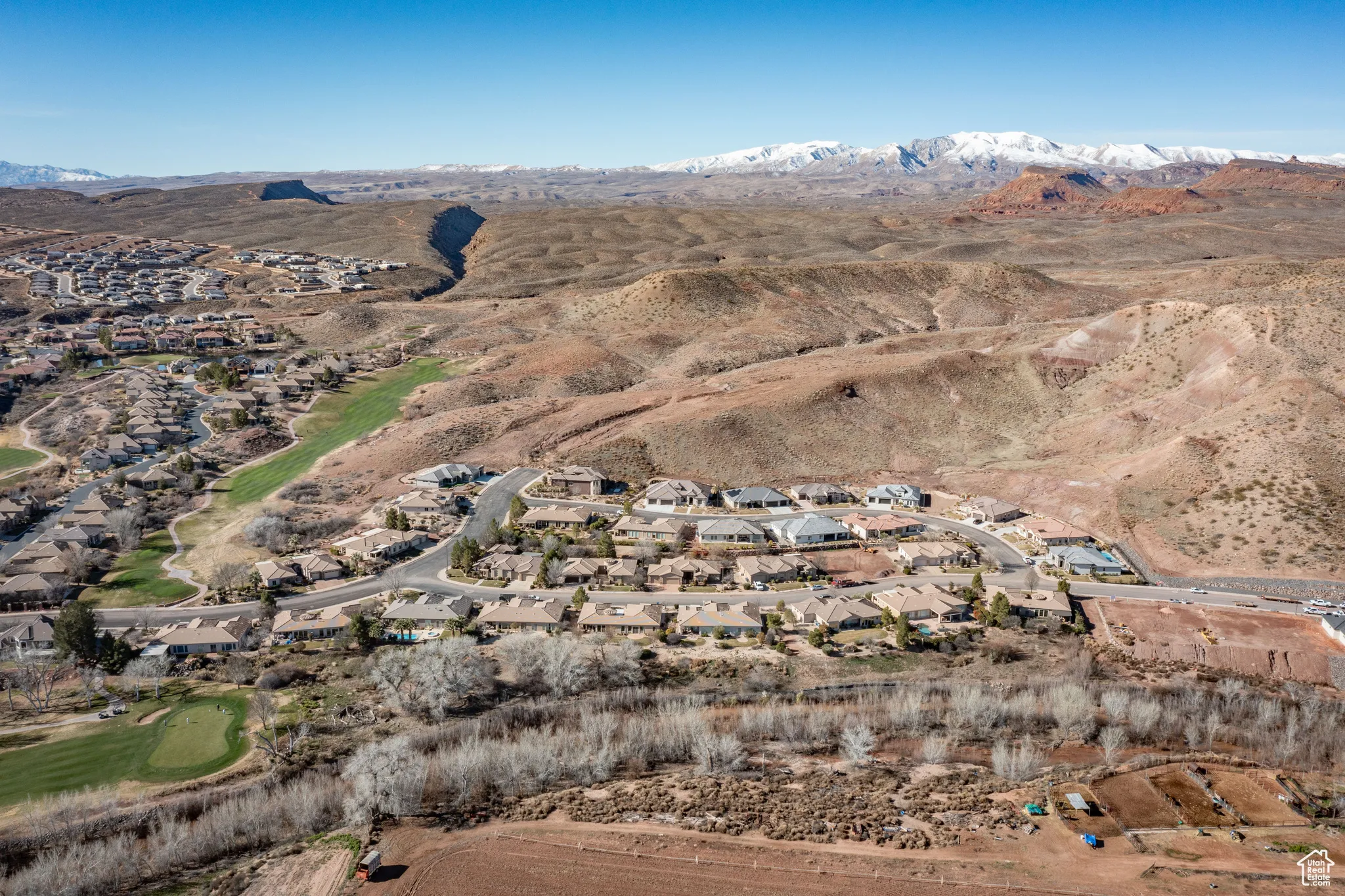 View of property location featuring nearby suburban area and a mountainous background