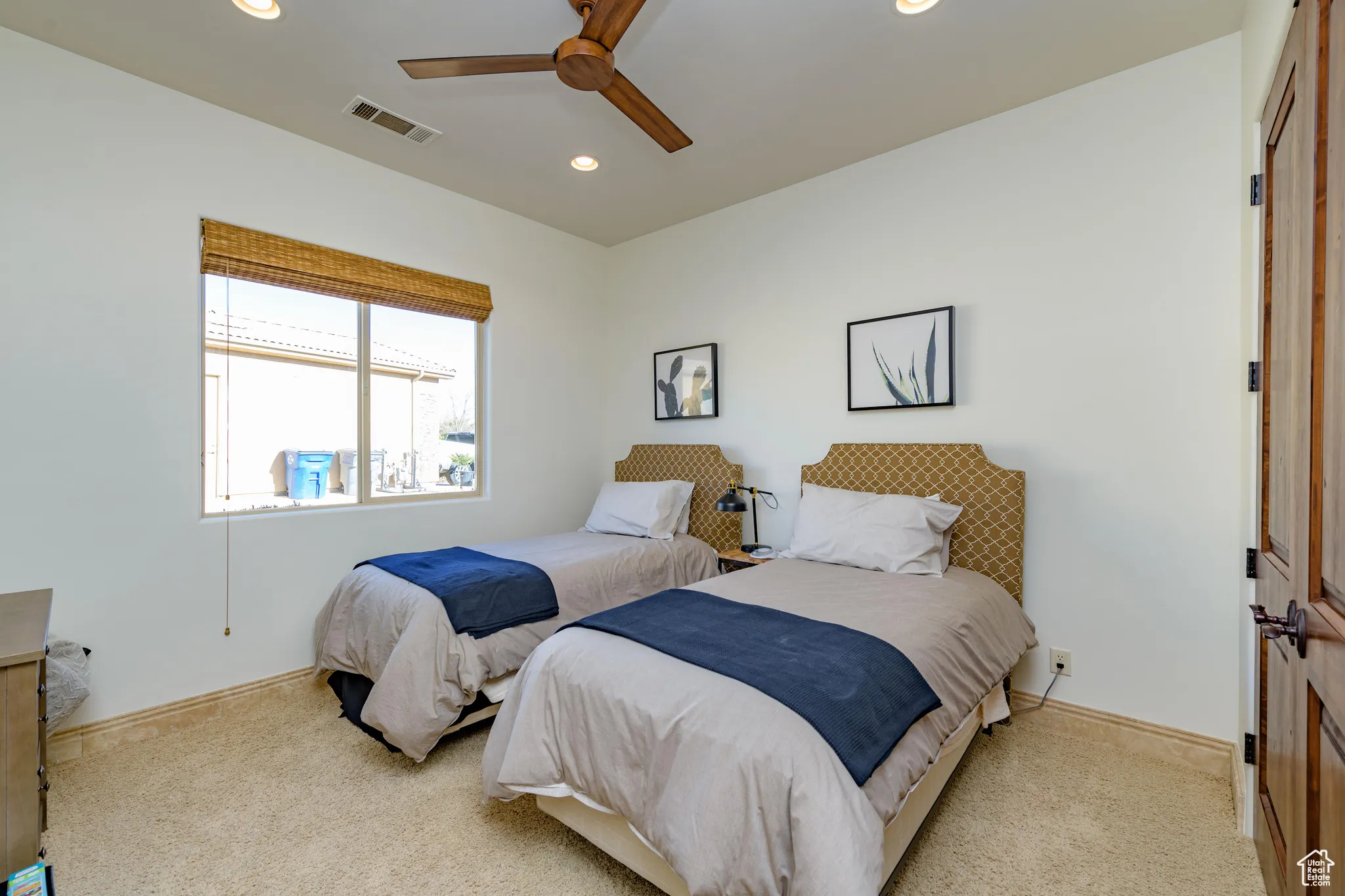 Carpeted bedroom with recessed lighting and ceiling fan
