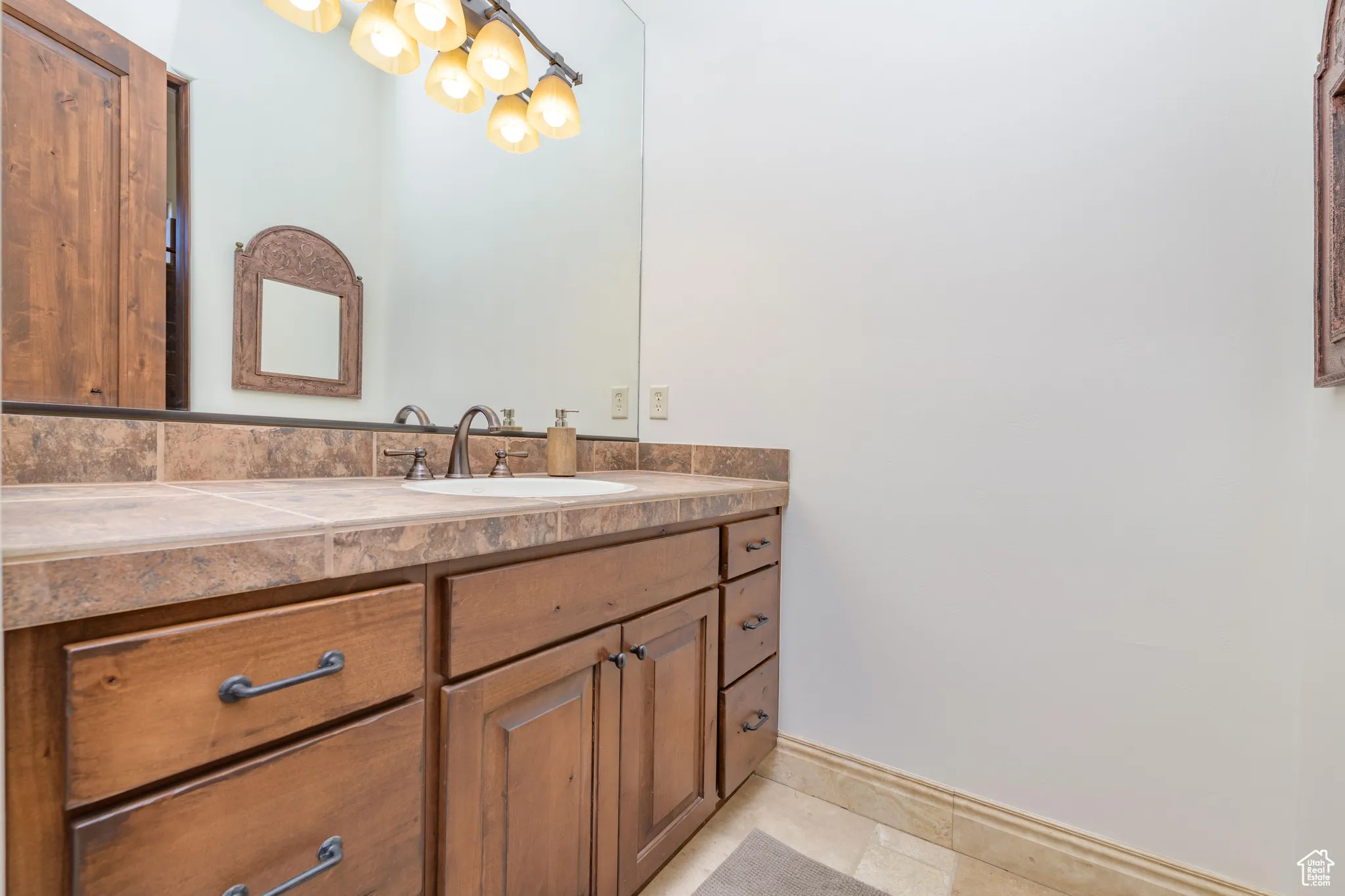 Bathroom featuring vanity and baseboards