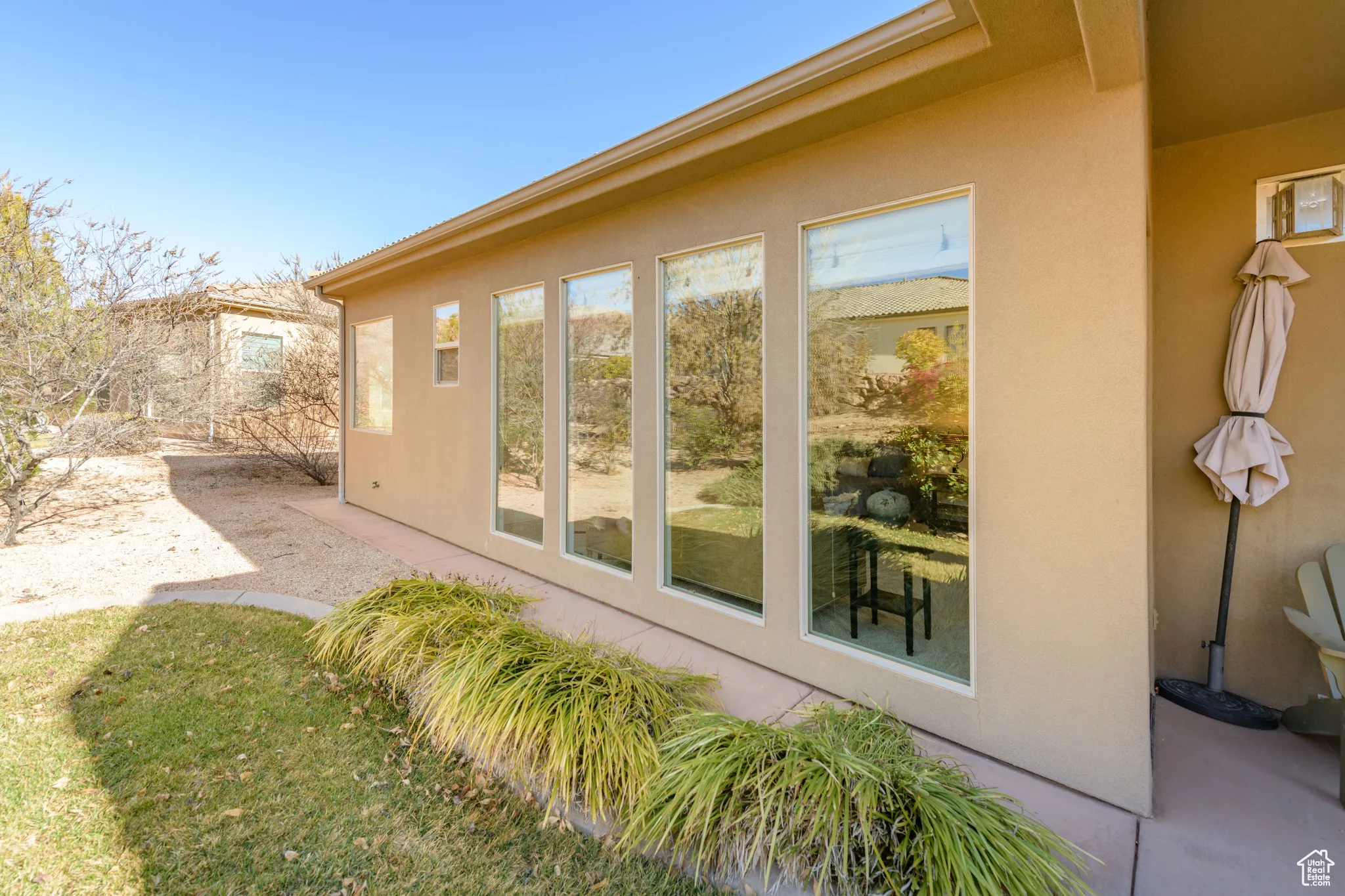 View of side of home with stucco siding