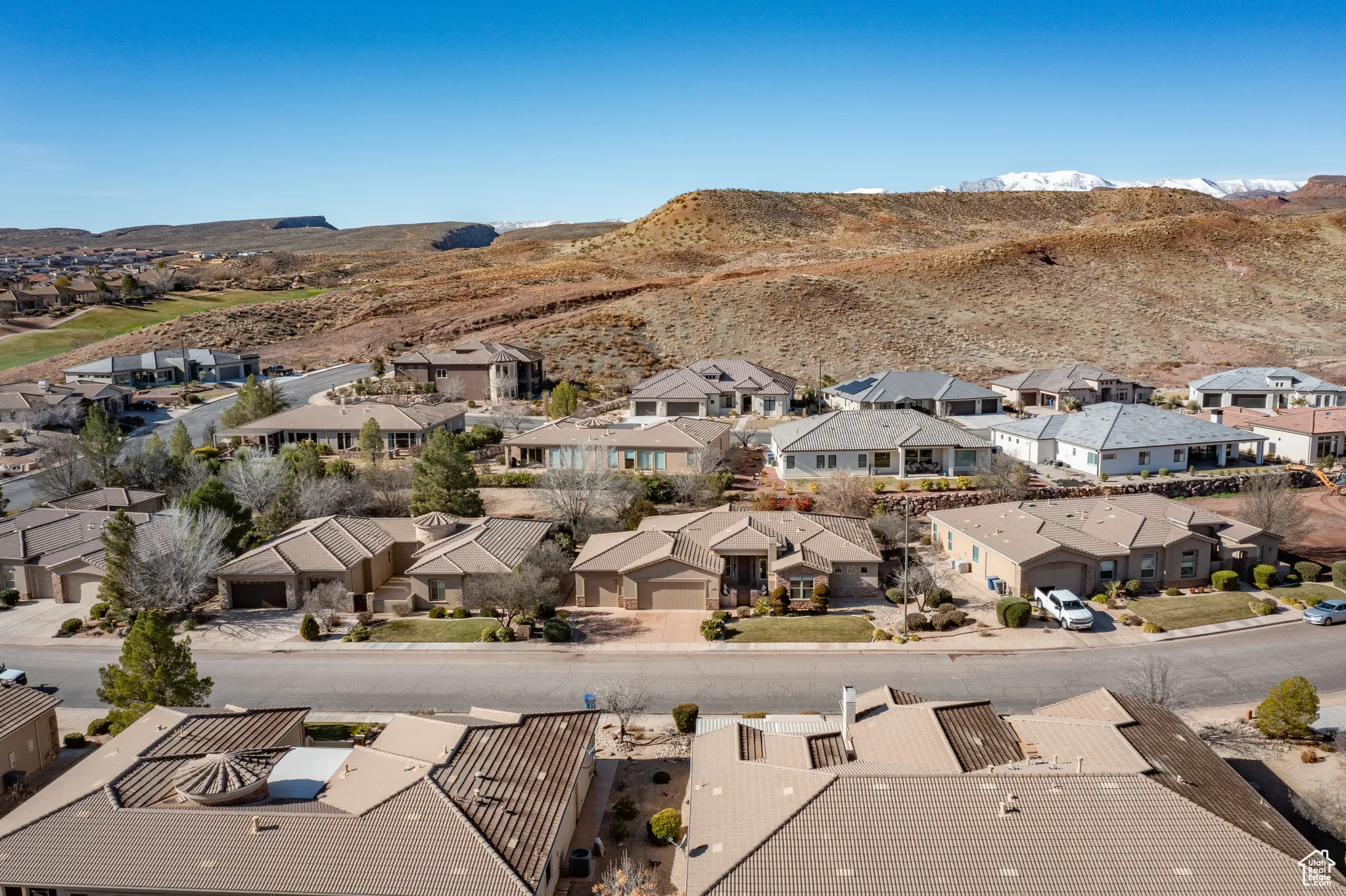 Aerial perspective of suburban area with a mountain backdrop