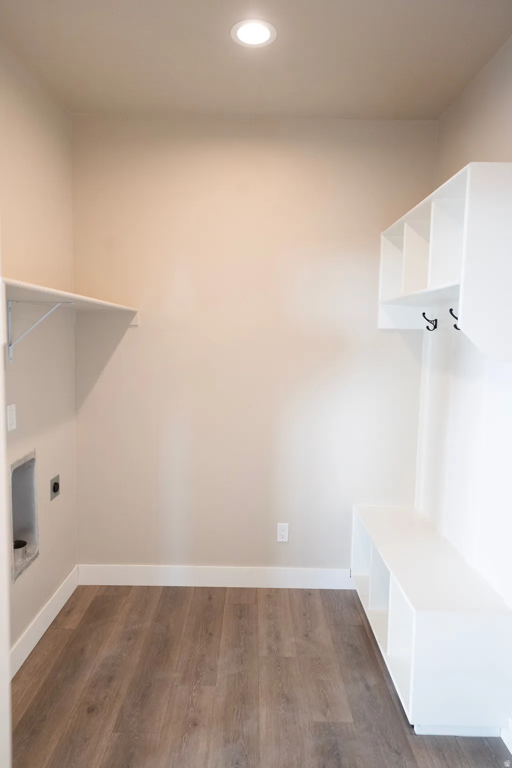 Laundry room with dark wood-style flooring, recessed lighting, and hookup for an electric dryer